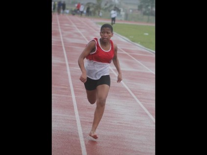 Speedster Mbali Magwaza of Mlalazi tore down the track in the rain in the girls 100m heat to finish third at the uThungulu District Games on Saturday