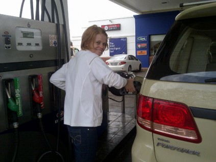 Sam Blaylock pumps fuel at her family's petrol station in Empangeni