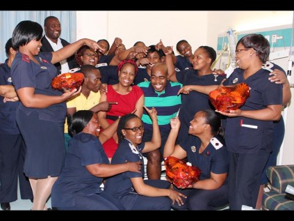 All the attention is on uMfolozi MM Elliot Gamede as nursing staff and colleagues, including Mayor Smanga Mgenge on Friday celebrated his discharge after five weeks at Netcare the Bay Hospital PHOTOS: Dave Savides