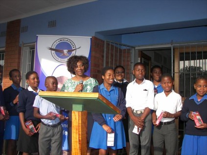 City of uMhlathuze deputy mayor Vera Gumbi hands over calculators to pupils
