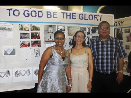 Linda Kunene, Yvette Canham and James Scharnick (Registrar of the Zululand Anglican Church) view the gallery of historical photos at the launch of the church's centenary celebrations on Thursday night