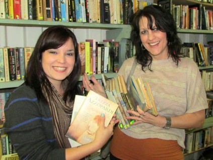 SPCA's bookworms Nasstasja and mother Daleen Schutte grab a variety of reading material from SPCA Richards Bay's bookstore