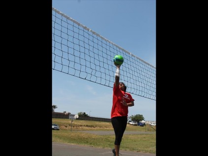 Beaulah Chinsamy goes all out to spike the ball during her game on Saturday