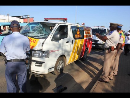 Police and traffic officers inspect the Kwazulu Private Ambulance that knocked the man