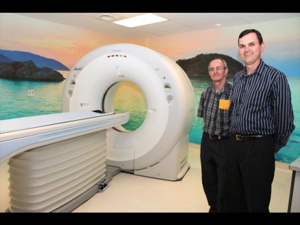 Consulting electrical engineer Danie van Wyk and Ds Tertius Naude, who officiated at the opening, admire the ‘space age’ linear reactor that will be used to treat cancer patients