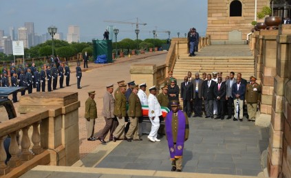 Members of the Mandela family watch as the coffin bearing the remains of former president Nelson Mandela as it is taken to the amphitheatre were it wil lie in state for the next three days for public viewing. PHOTO: Masi LosiPretoria NewsPool