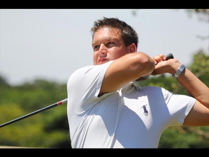 Brian Carpenter drives off the second tee