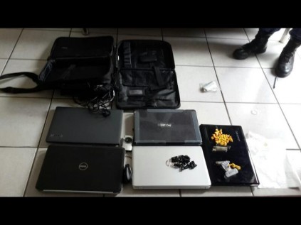 Police found various drugs and five laptops during the raid