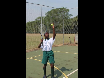 Wandile Okesola lines the ball up as he gets ready to serve