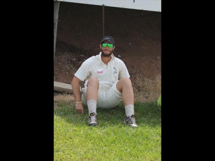 Twelfth man Trevor Kietzmann was caught relaxing on the bank whilst his team mates sweated it out on the park in the heat