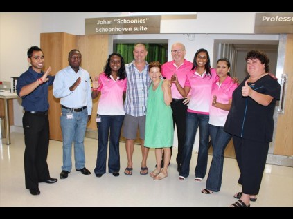 Labelled a ‘fantastic, positive patient’, Doug Bain and his wife Desiree were given a rousing send-off when he completed his last radiation treatment on Friday. They were given a gift and memento by (from left) Rishaav Rammy, Vincent Maselesele, Raksha Singh, Mark Palmer, Natalie Rajagopaul, Revasha Ramsing and Magret Peens PHOTOS: Dave Savides
