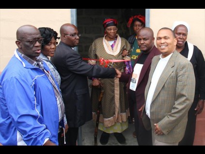 uMlalazi municipal manager Simon Mashobane, Rev FB Sibiya (uMhlathuze Parish), Dean JS Ndlovu (Empangeni Circuit), gogo Anna Mpungose, Jennifer Mdletshe, Cllr TA Hlatshwayo, Cllr and Rev Hughes (uMhlathuze Parish) cutting the ribbon of the housePHOTOS: Larry Bentley