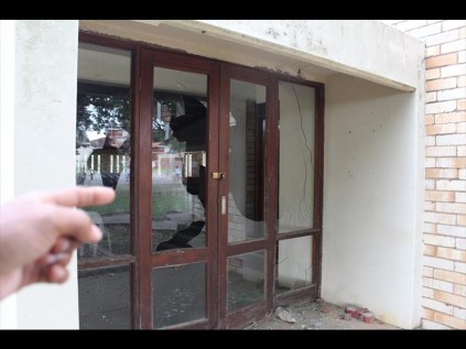 Glass doors and windows at the institutions chapel are completely shuttered