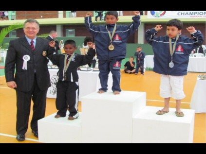 Jayden Govender from Brackenham (black tracksuit) was awarded bronze by President of All Africa Goju Kai Karate and Vice-President of IKGA Peter Brandon Hanshi. The six-year-old was the youngest competitor from all provinces at the tournament