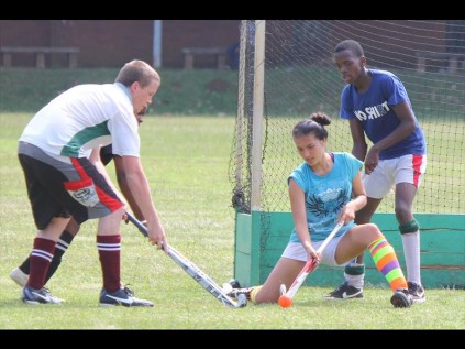 Sumana Pepper and Wandile Dlamini block the goal as Daniel Oscroft tries to take a shot