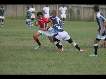 Felixton College pupil Ben Boogaard gets rid of a Richards Bay Christian School defender as he surges forwardPHOTOS: Richard Springorum