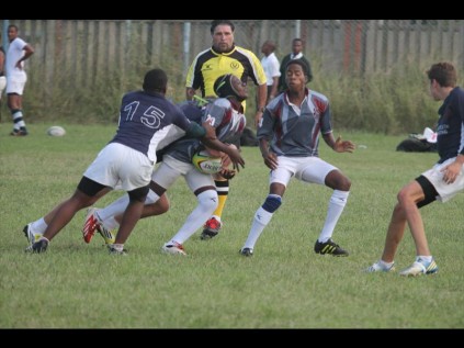 John Ross College rugby player Kwanele Hlengwa got wrapped up by the Creston College defence