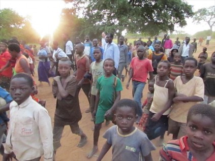 Many Zambian children make their way to hear the Word of God by Empangeni's Pastor Mike Geel