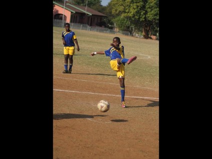 Ngcebo Makhatini of Empangeni Preparatory School takes a shot at goal