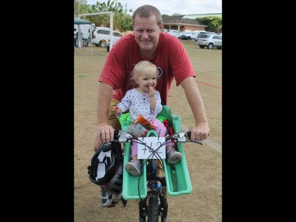Lelei Adam was the youngest competitor on the day at 18 months, with dad Joop having to do the hard yards