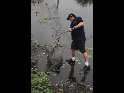 Jeffrey Phillips tries to get out the water on approach to the 8th hole