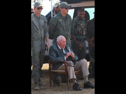 Dr Ian Player address the children on his arrival by helicopter at the Masinda airstrip, with field rangers in support PHOTOS: Larry Bentley