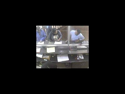 The first suspect (left) in blue overalls caught on CCTV camera at the Bayside Lodge