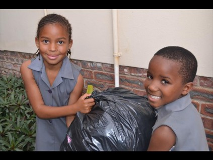 Hard at work were Grade 3 pupils Snethemba Simelane and Nompumelelo Sithole who helped carry all the heavy black bags, which were filled to the brim with beautiful clothes.