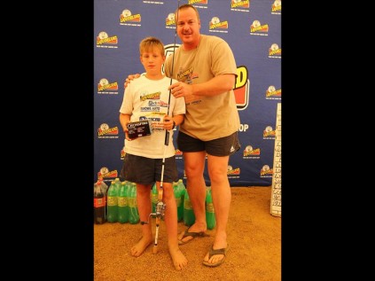 Junior barbel (5.88kg) winner Tian Marais receives his prizes from Jason BanksPHOTOS: Larry Bentley