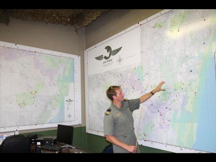 At the upgraded Hluhluwe airfield operations base, ZAP-Wing pilot Menno Buyze refers to an aerial map that displays detailed information such as contact with poachers, arrests, recovered rhino carcasses and airstrips PHOTOS: Larry Bentley