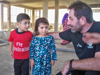 Prof Jean Simonis shares a moment with Kurdish children