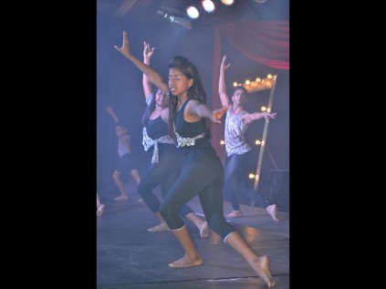 Tamica Biggar in the lead with Alexandra Chaturi and dance instructor Craig Reddy in the background during one of the group performances