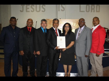 The New Life Church Council - Brendon Murugan, Charles Naidoo, Chan Budhram, Dr Daniel Munsami, Shirley Munsami, Elder Derrick Govender and Ryan Abrahams welcome the conferral of the church's title deed