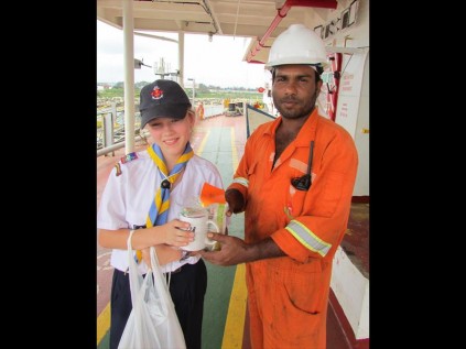 Beth Laas hands over a mug to Ali Nooge