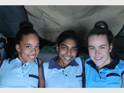 St Catherine's swimmers Toni Hall, Robyn Chinnappen and Michelle Frenzel take a break in their tent during the challenging event PHOTOS: Richard Springorum