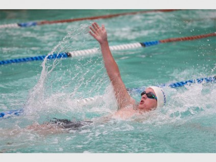 Thomas Davidson cruising through the pool in the boys' backstroke event