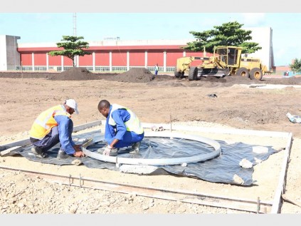 The athletics arena at the Central Sports Complex is a hive of activity as infrastructure for field items is installed PHOTOS: DAVE SAVIDES