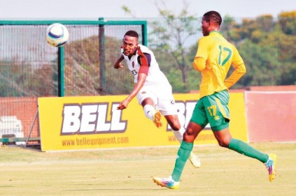 Thanda captain Thabang Thopola shoots at goal as Boroka's defender Reginald Sebanyoni is too late to block the shot PHOTO: Larry Bentley