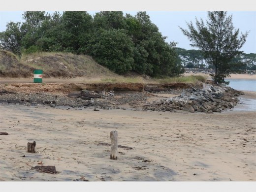High tide surges continue to do damage to the road at Pelican Island