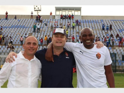 Thanda FC Chairman, Pierre Delvaux embraces Head Coach, Vladislav Heric and Assistant Coach, Asanda Mvalo after they successfully plotted the 3-1 victory over Cape Town All Stars PHOTO: DAVE SAVIDES