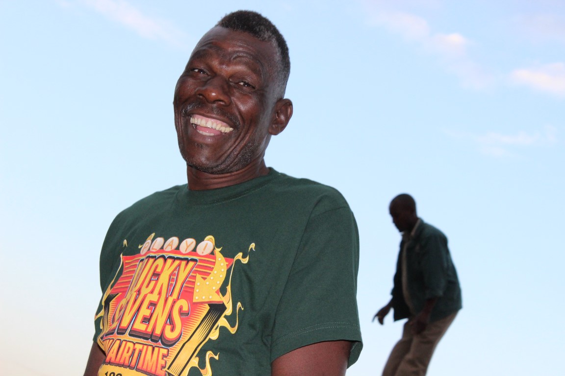 Frank Nkwanyana, a game hand, smiles for a picture just before game was released at Enseleni Nature Reserve