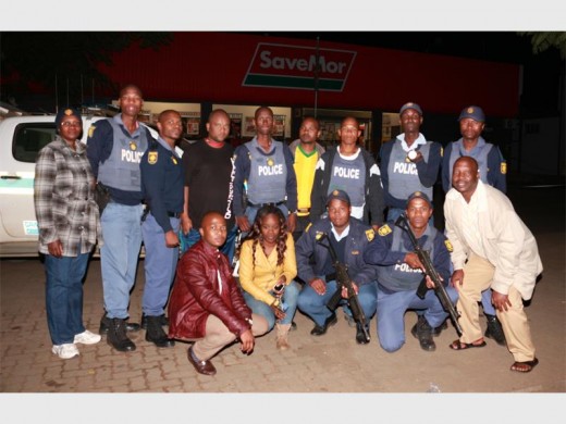 Kwambonambi SAPS Communications Officer Lt MH Mthethwa (extreme left) with members of the nearby police station who scrambled to the scene and confronted the armed gangPhotos: Dave Savides