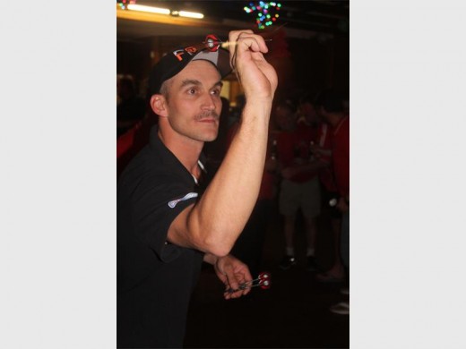 Dart Casters captain Kevin Rudolph aiming at the trip 20