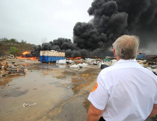 Rassie Erasmus of Rural Metro Fire and Rescue watches as yet another fire takes hold at a factory in iSithebe on Tuesday, 8 March. Photo - Kyle Cowan