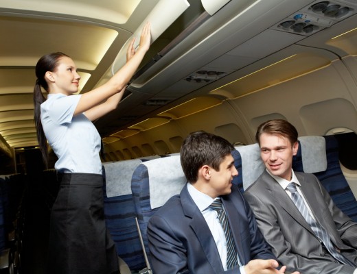 flight-attendant-overhead-bin