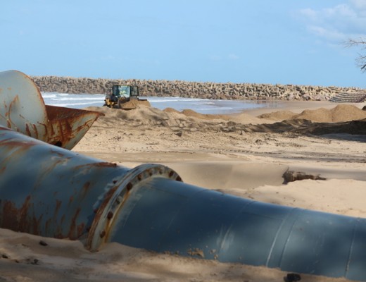 A build-up of sand at the dredger pipe outfall is being mechanically spread along the beach