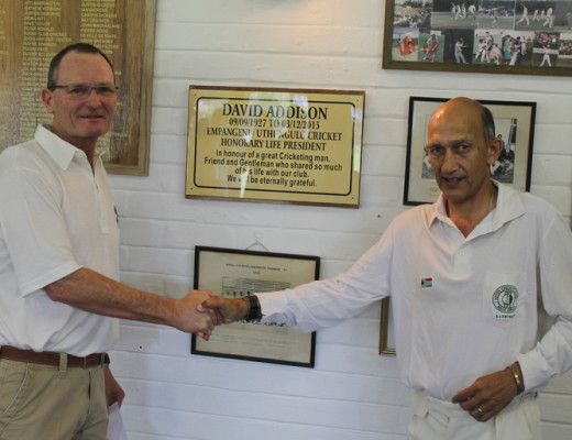 Patch Addison (left), son of David Addison, unveils the plague in memory of his dad. With him is Paul Gouge