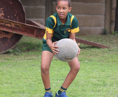 Grantham Park Primary's Asande Mdluli works hard to rack up points in the medicine ball lifts