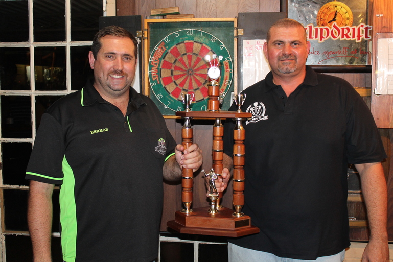 Captain of defending champions Hullets, Herman Steyn hands over the trophy to Impis captain Vleis van der Westhuizen