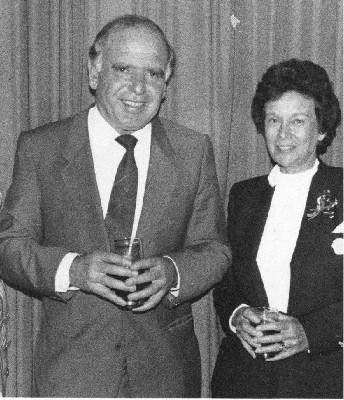 Business guru Raymond Ackerman shares a light-hearted moment with Regina Anthony